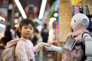 Asian child with friendly robot